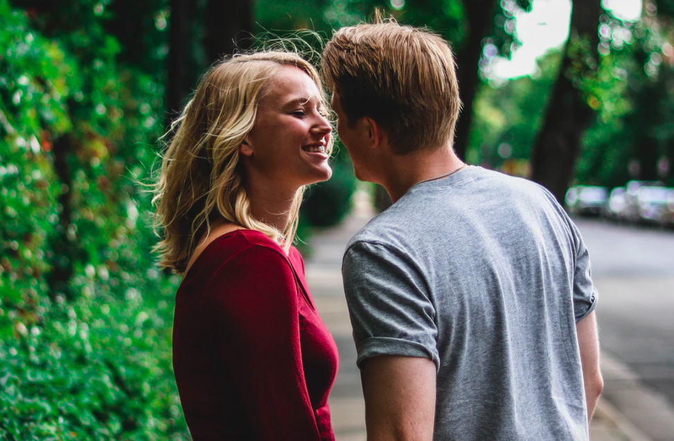 Couple kissing on sidewalk