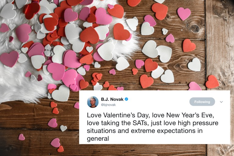 A table full of paper hearts and a tweet from BJ Novak about Valentine's Day