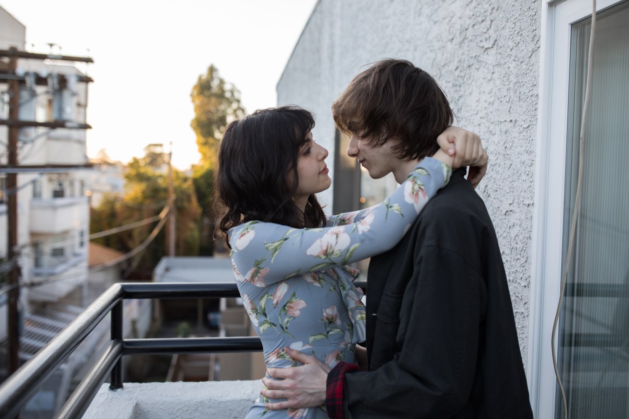 couple standing on balcony