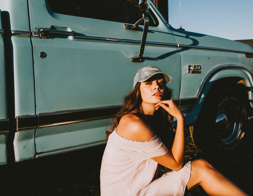 woman baseball cap truck