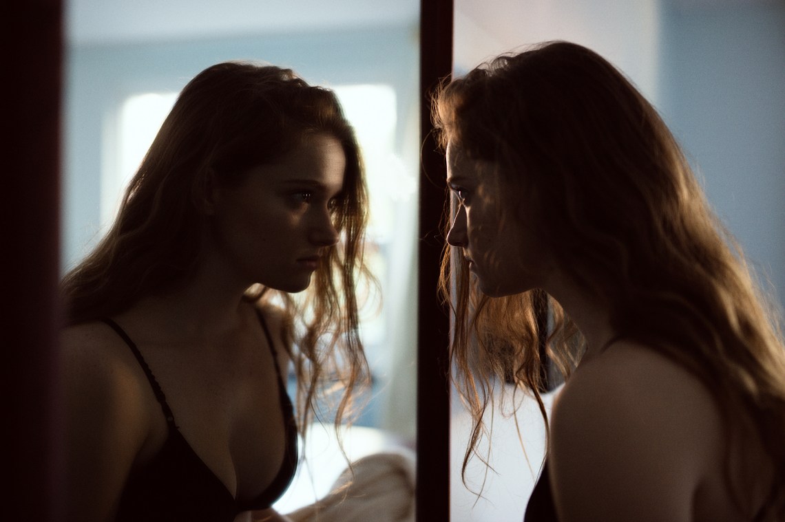 A girl in front of a mirror