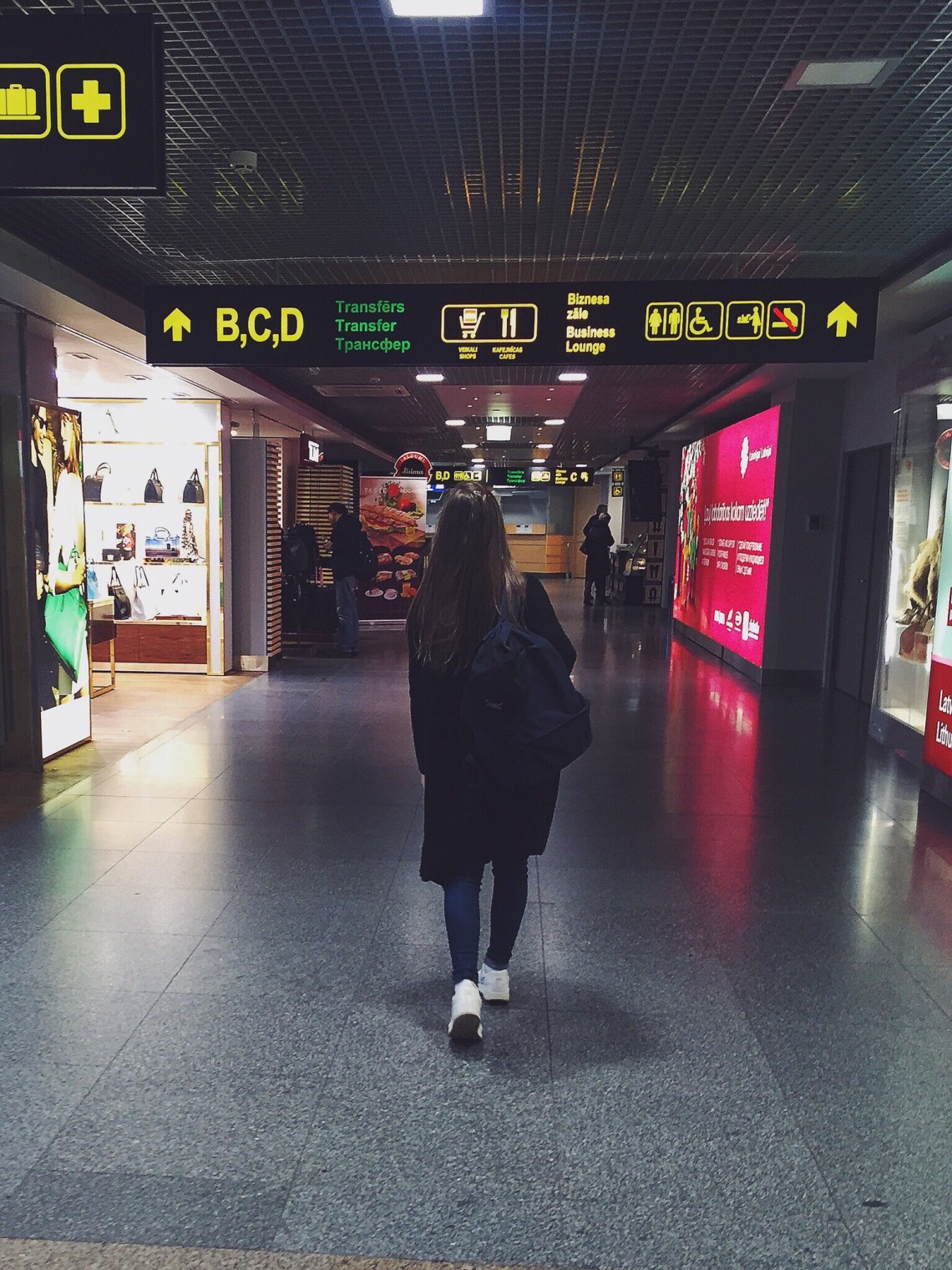 woman walking through airport