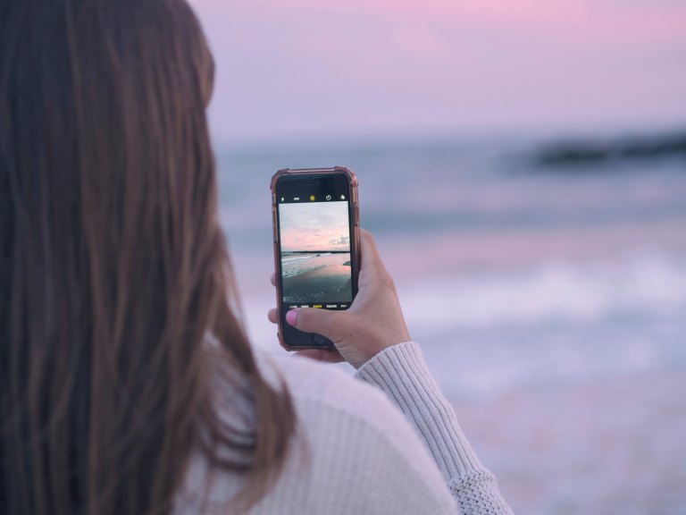 woman taking photograph