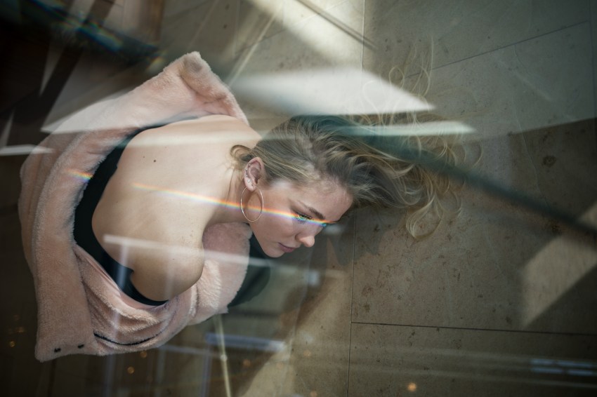 woman on floor feeling lonely