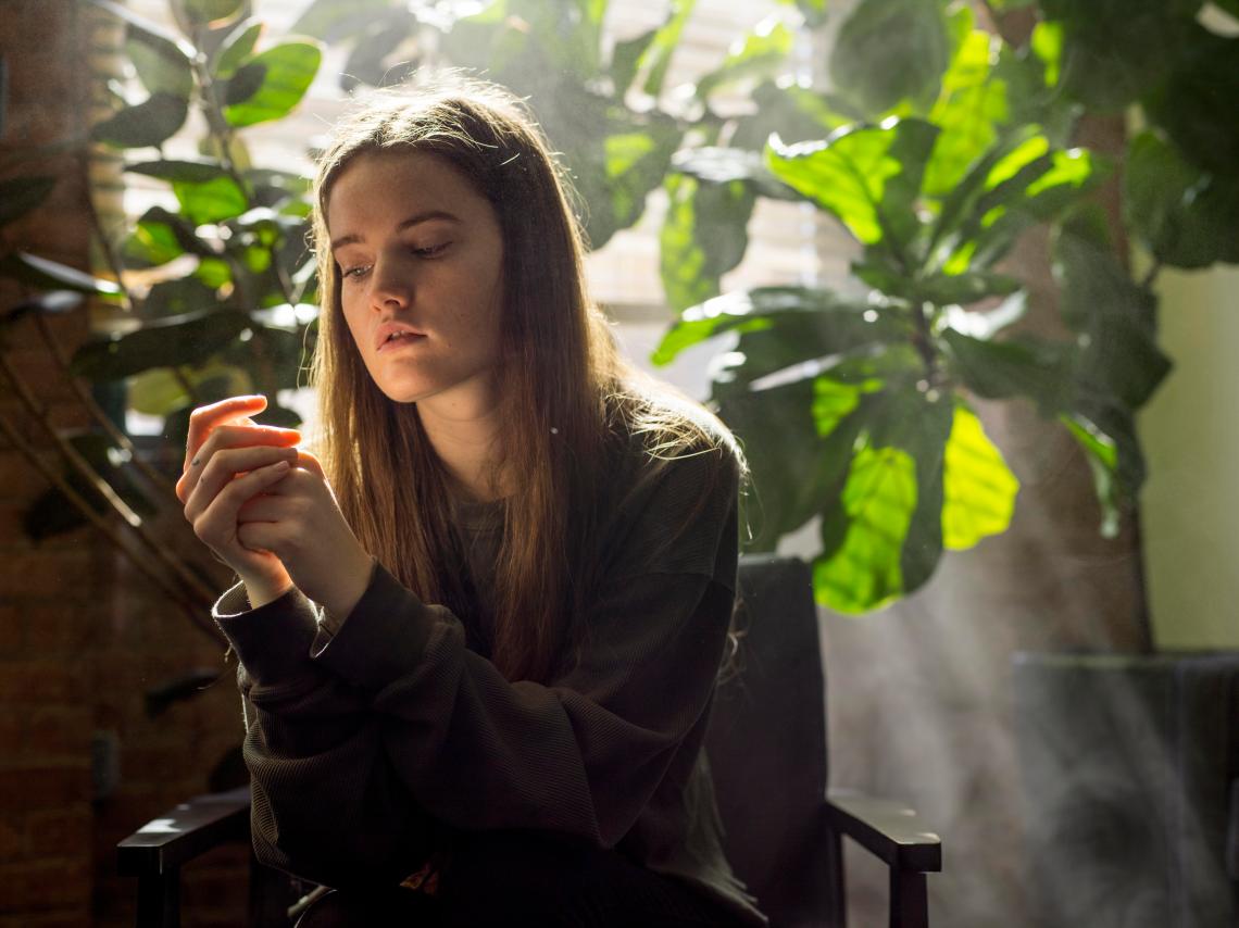 woman sitting looking contemplative