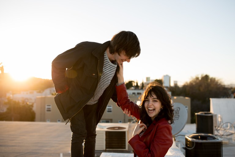 couple looking happy together on rooftop