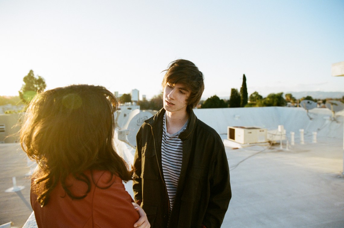 couple looking at each other on rooftop