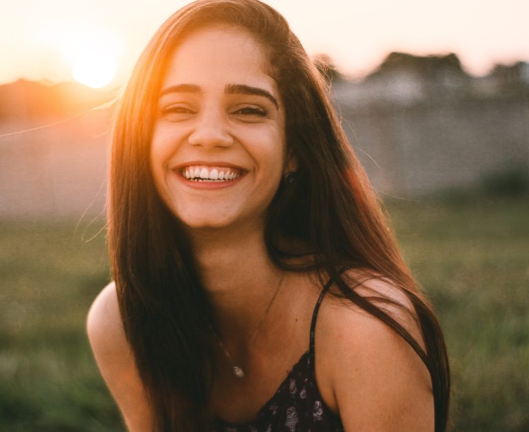 A classy, intelligent girl laughing