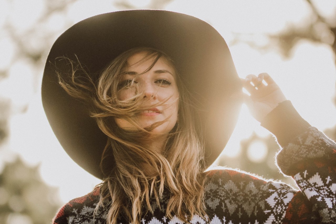 wind hair sunlight hat