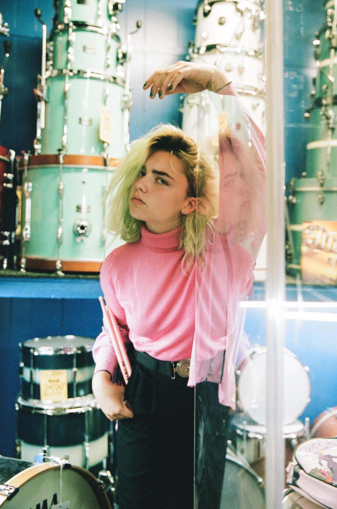 girl standing in music shop