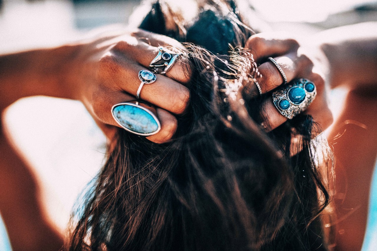 woman wearing turquoise rings