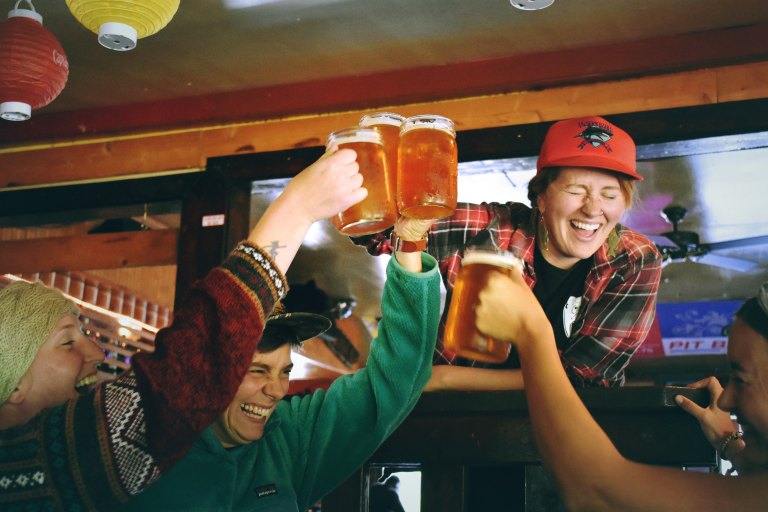 friends drinking mugs of beer