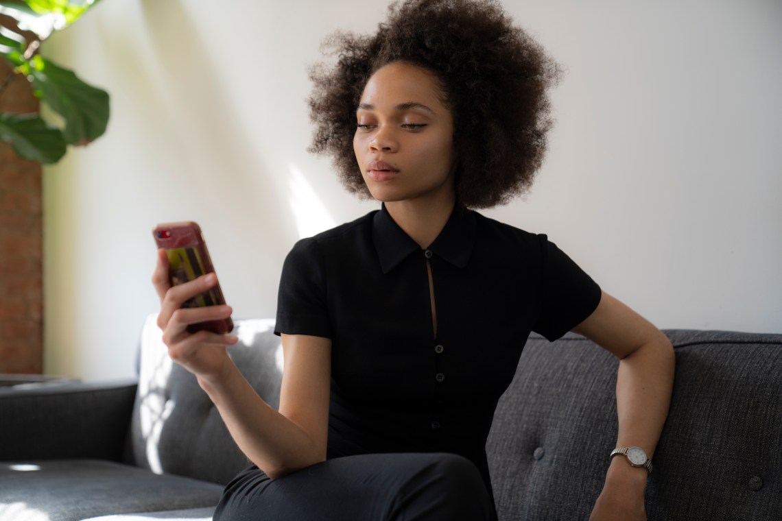 woman texting unimpressed