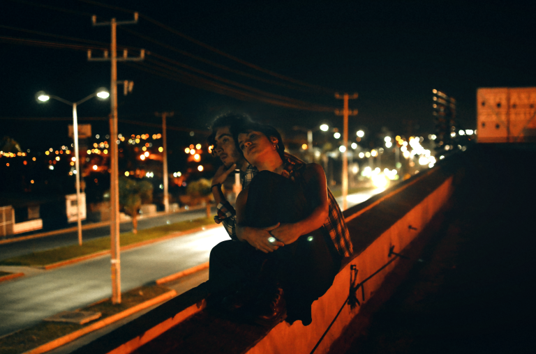 couple embrace at night