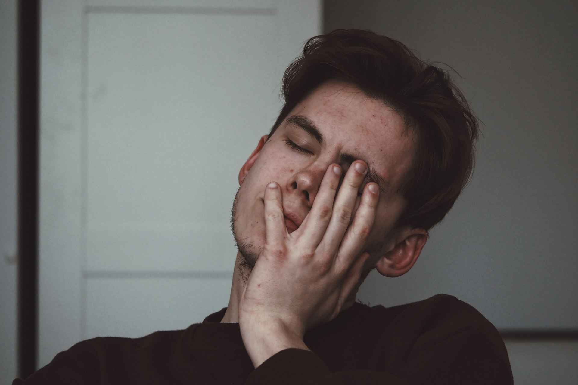 man wearing black crew-neck top