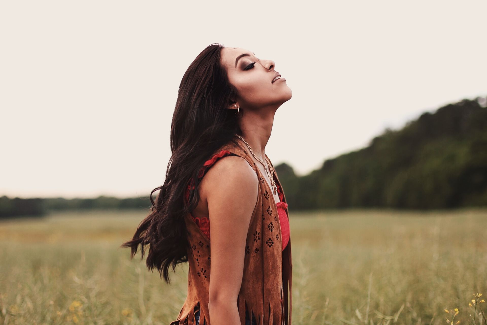 woman standing near grass field