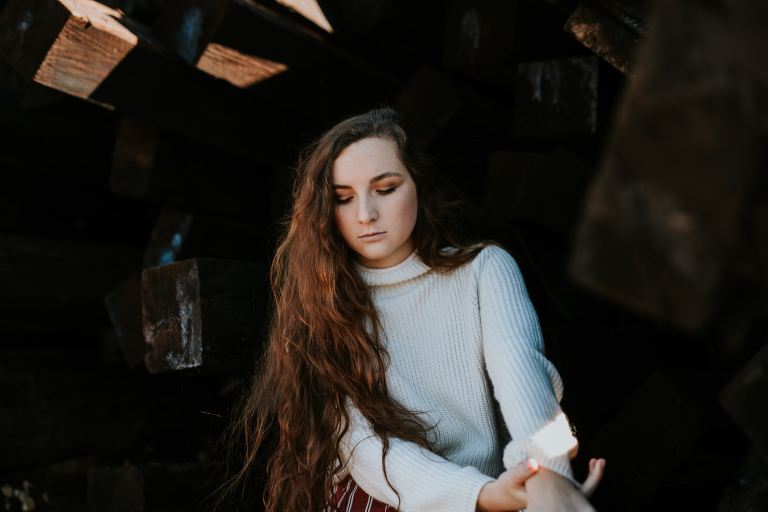 woman wearing white sweater