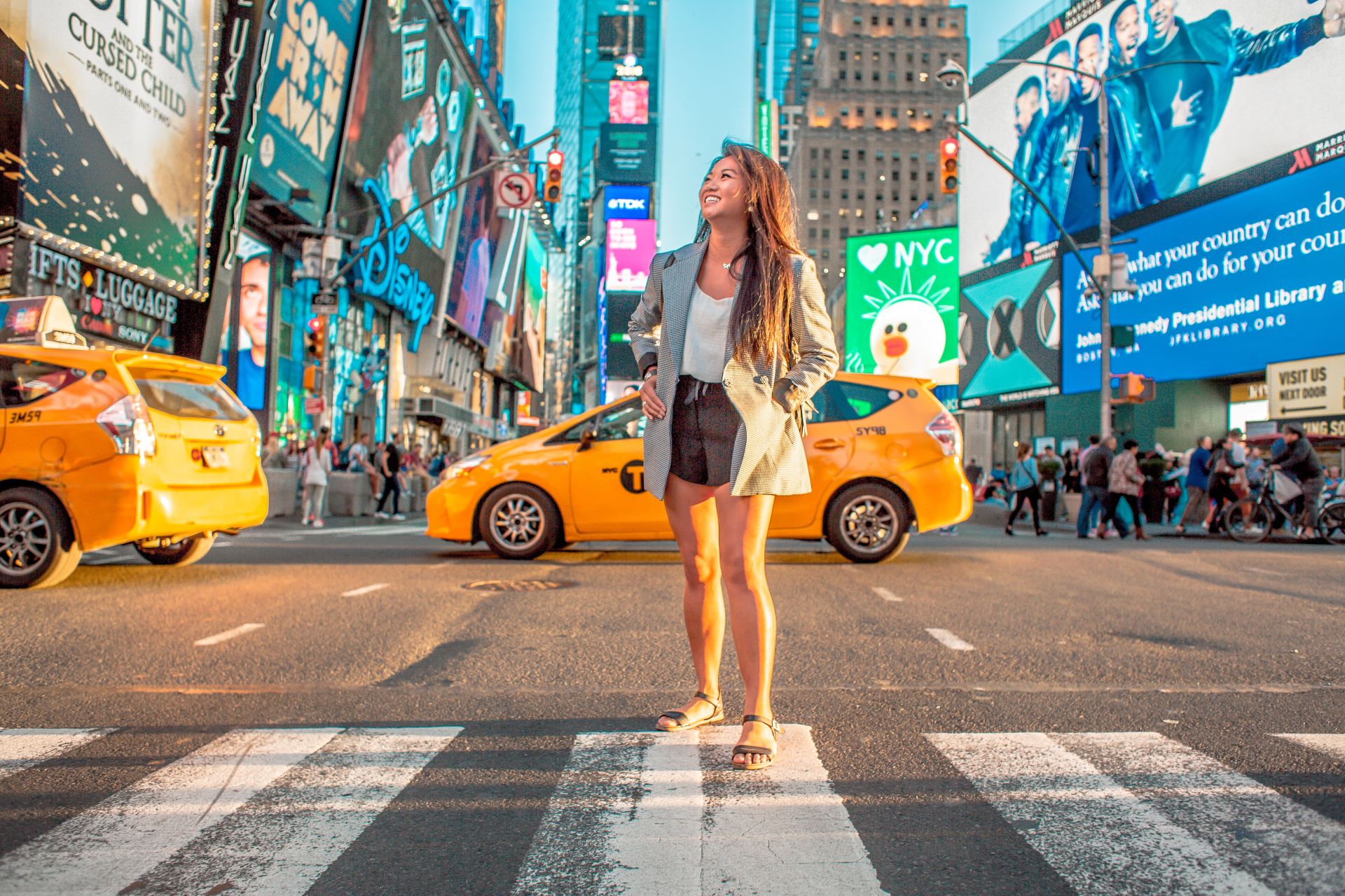 woman standing on pedestrian lane