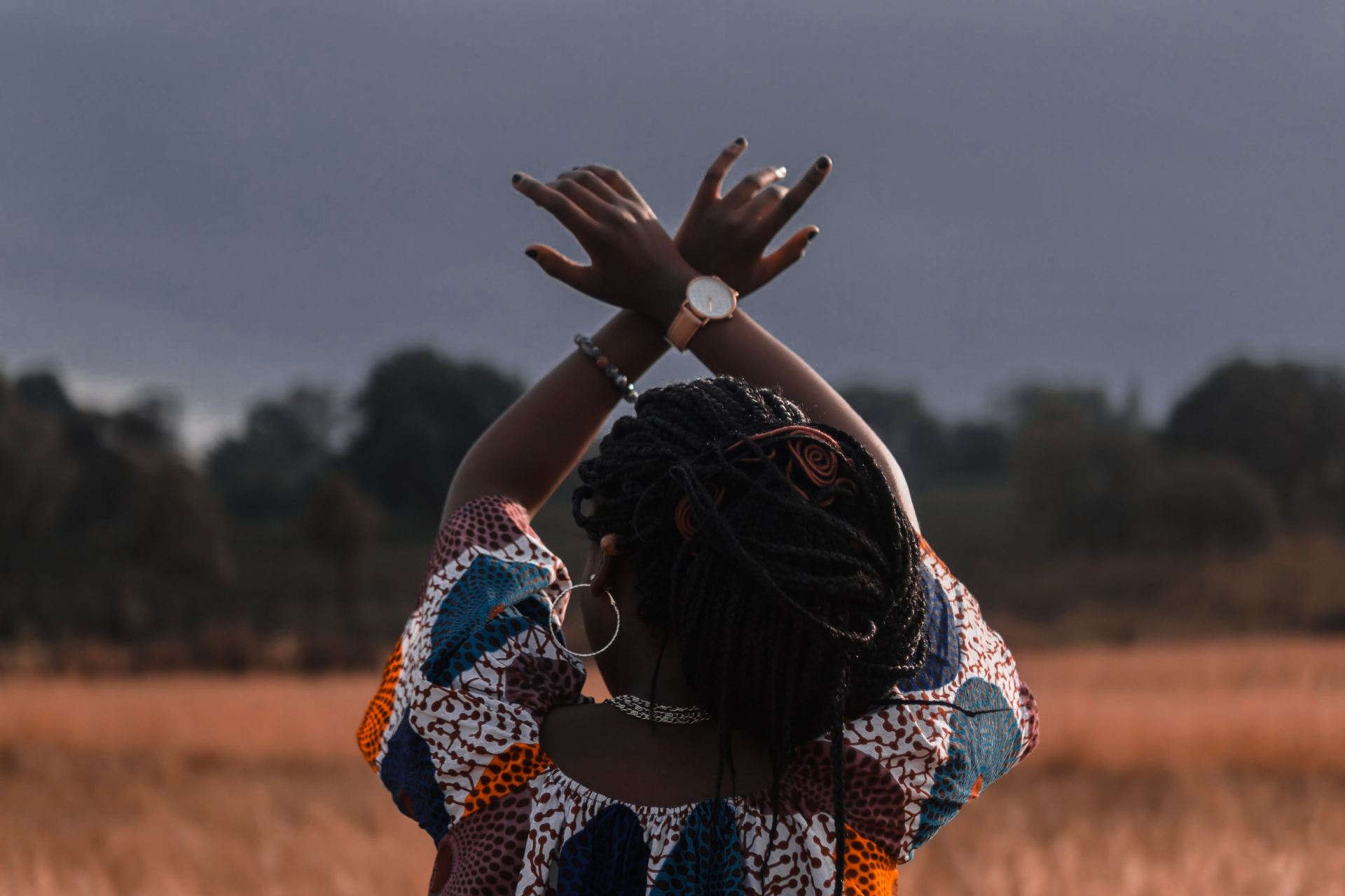 woman standing in the middle of wheat field