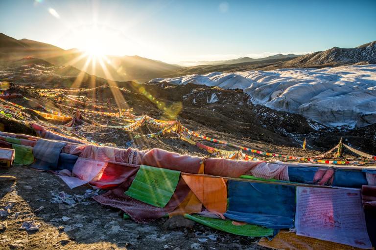 multicolored lines on hill under clear sky during sunrise photo