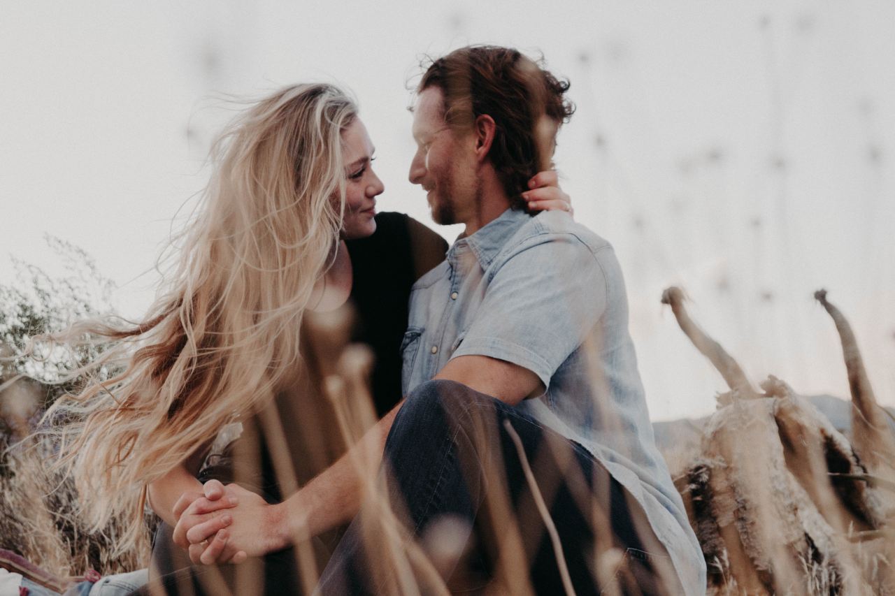 couple looking at each other while holding hands