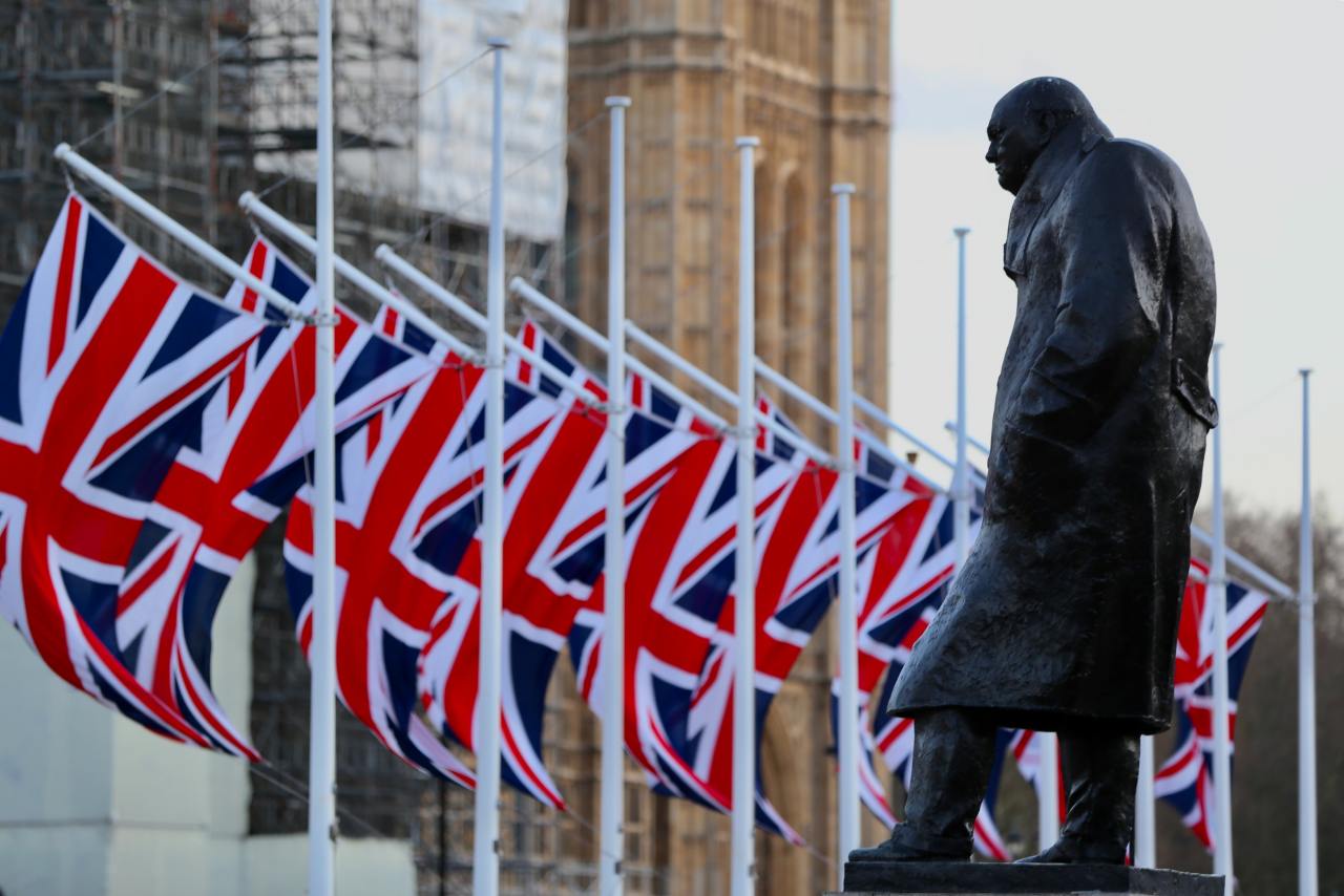 Winston Churchill near the English flag