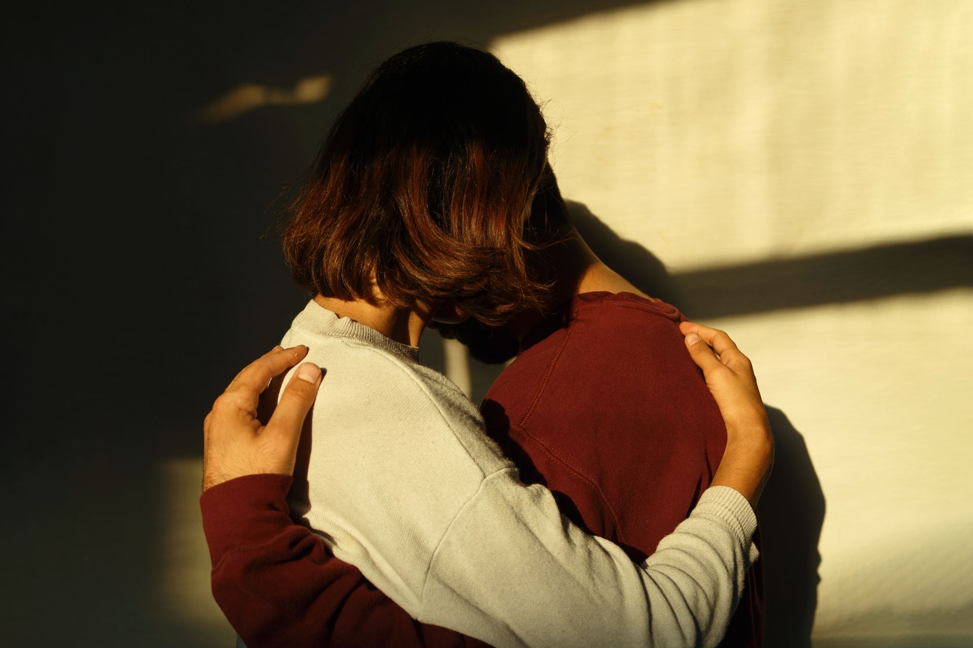 man and woman hugging each other