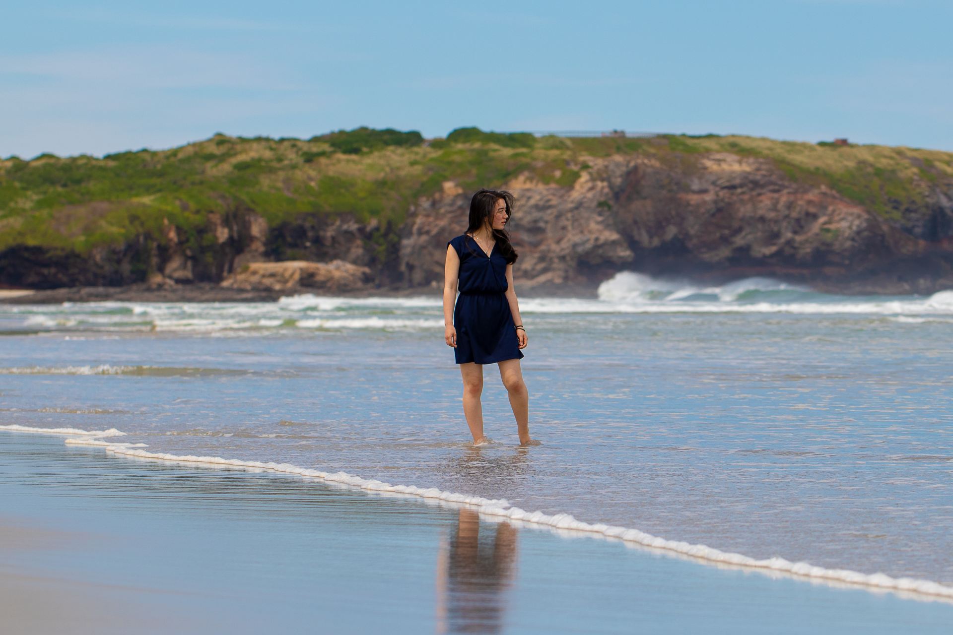 woman standing near body of water