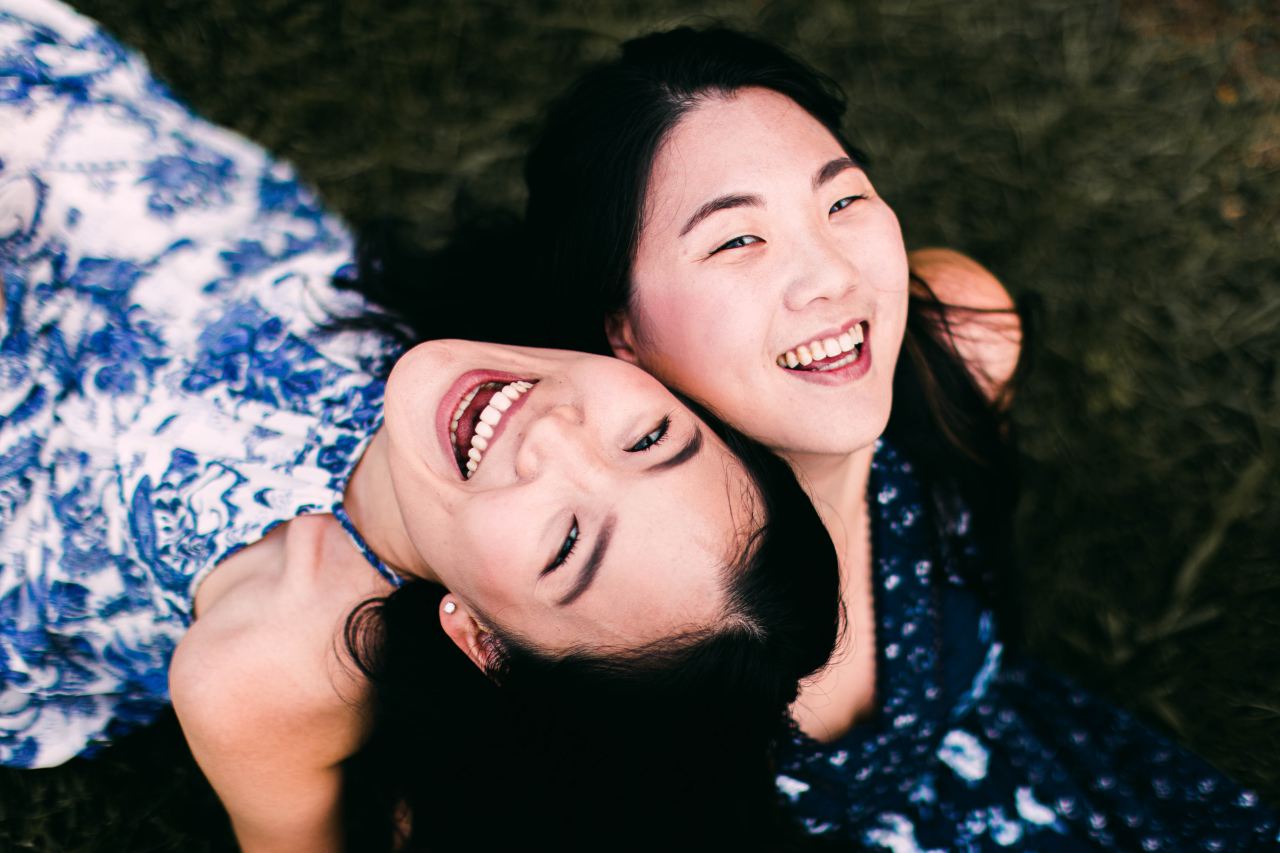 2 women lying on ground