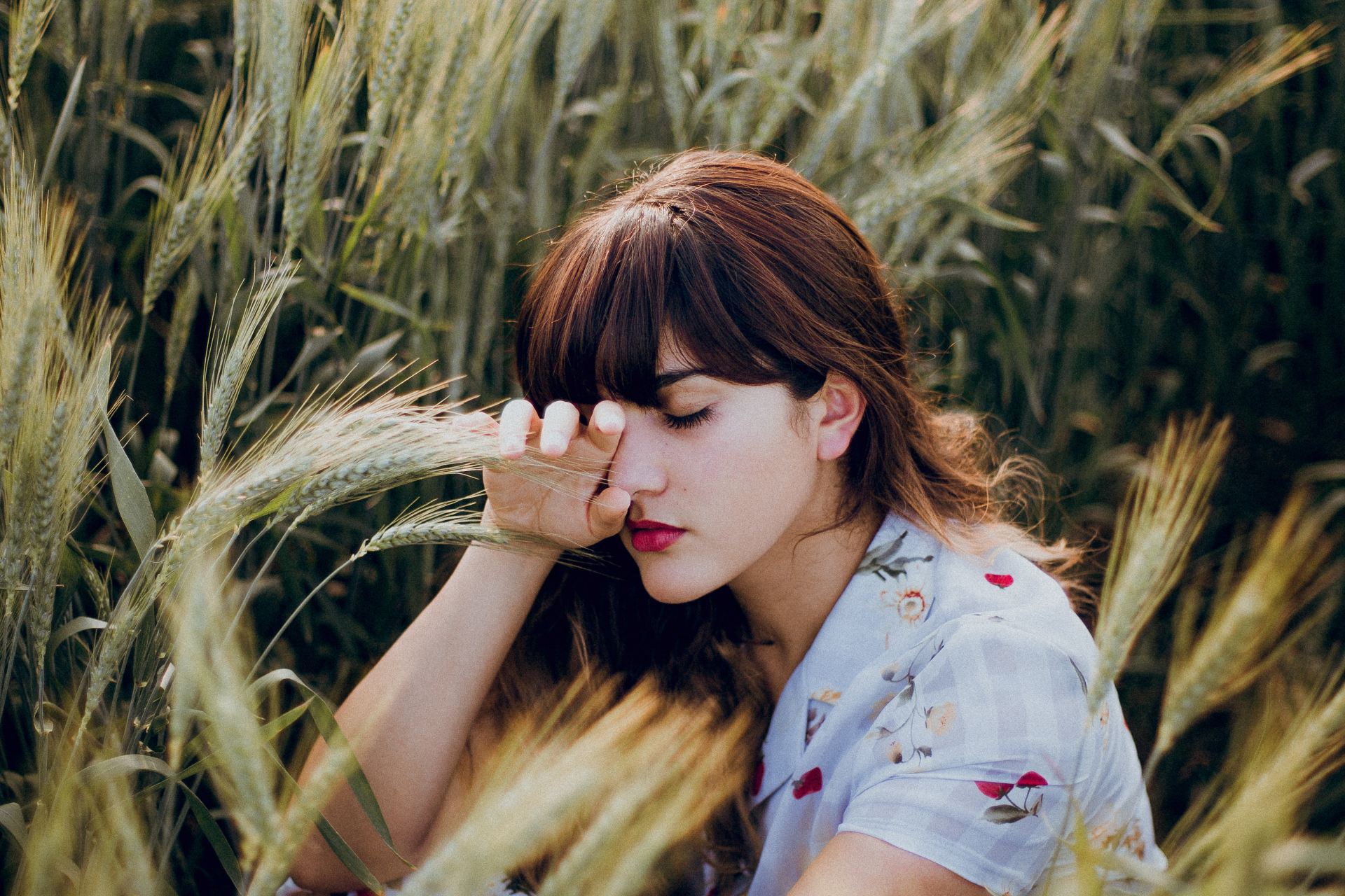 woman sitting on grass