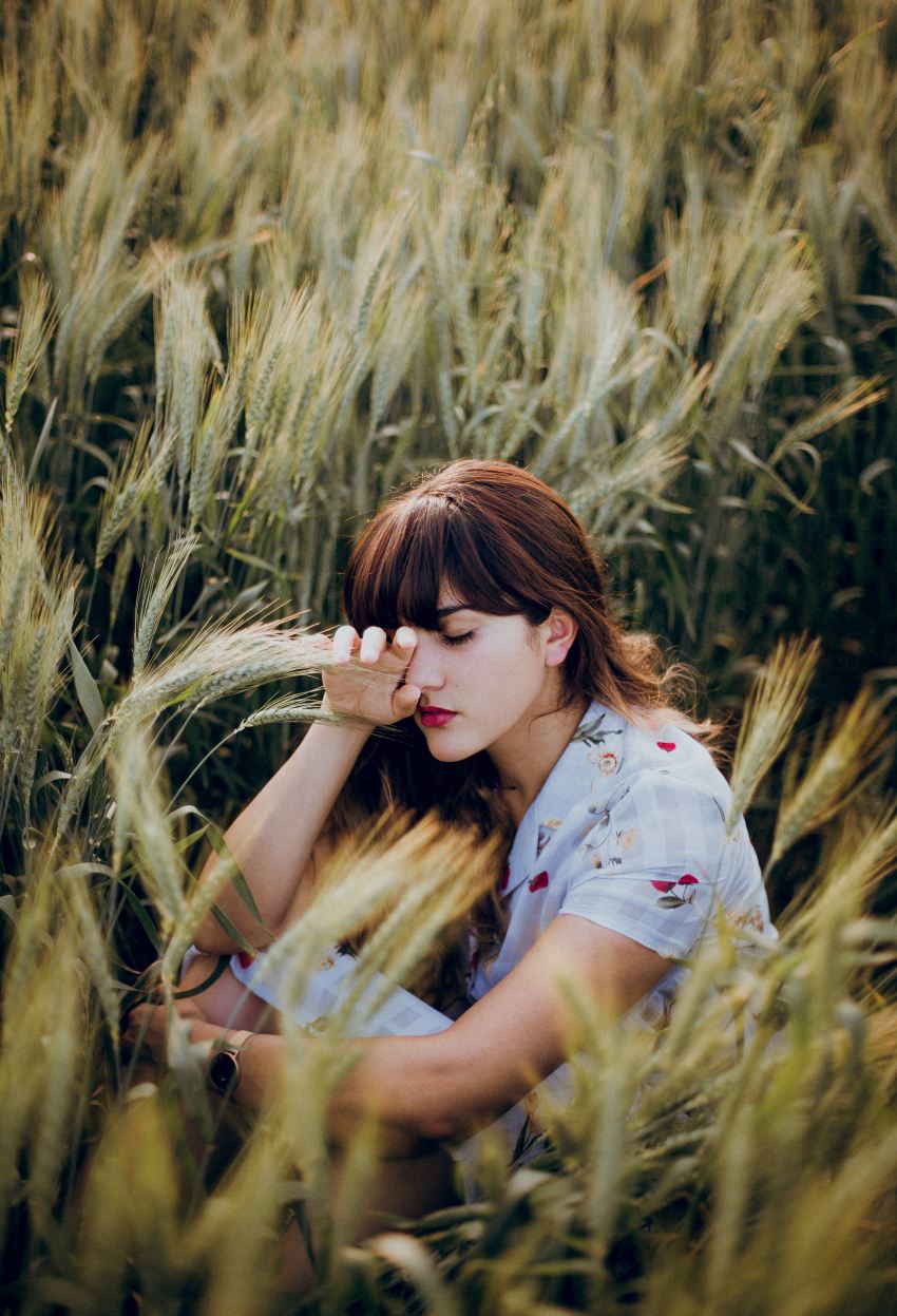 woman sitting on grass