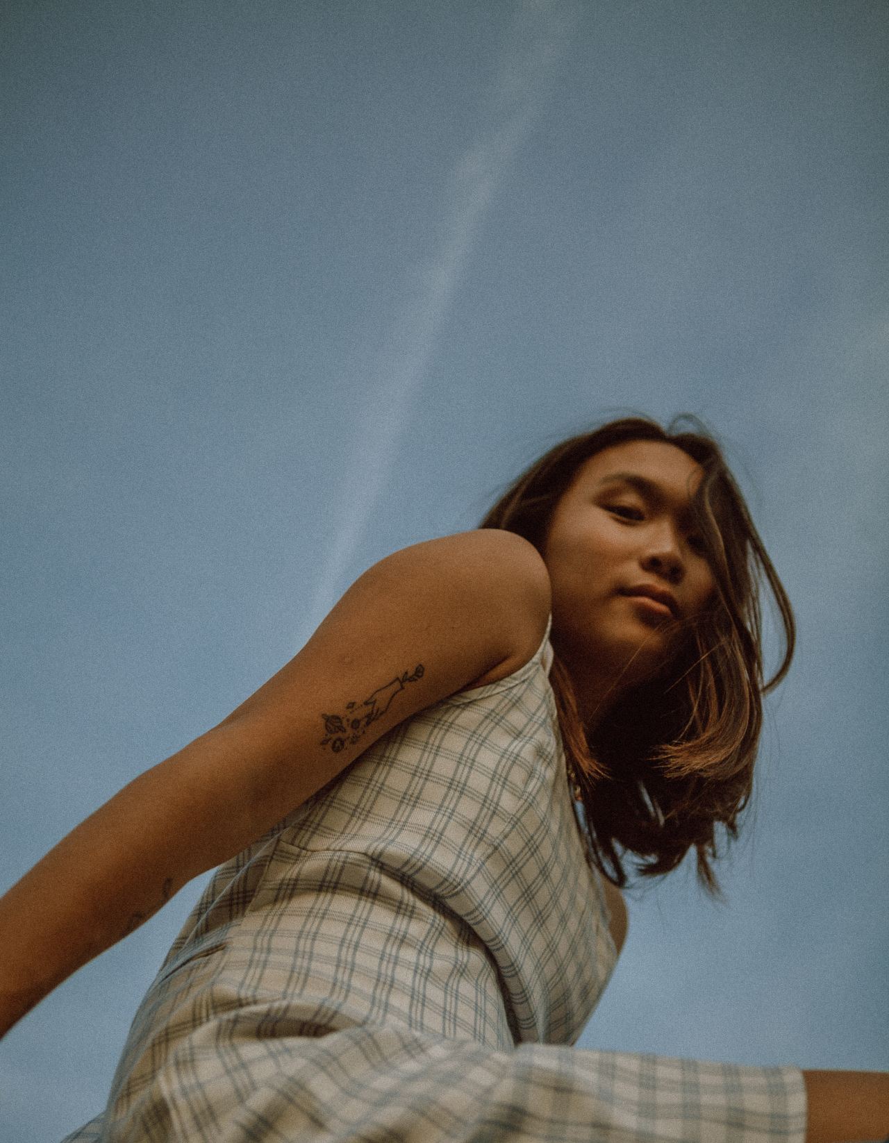 woman in white and black plaid button up shirt