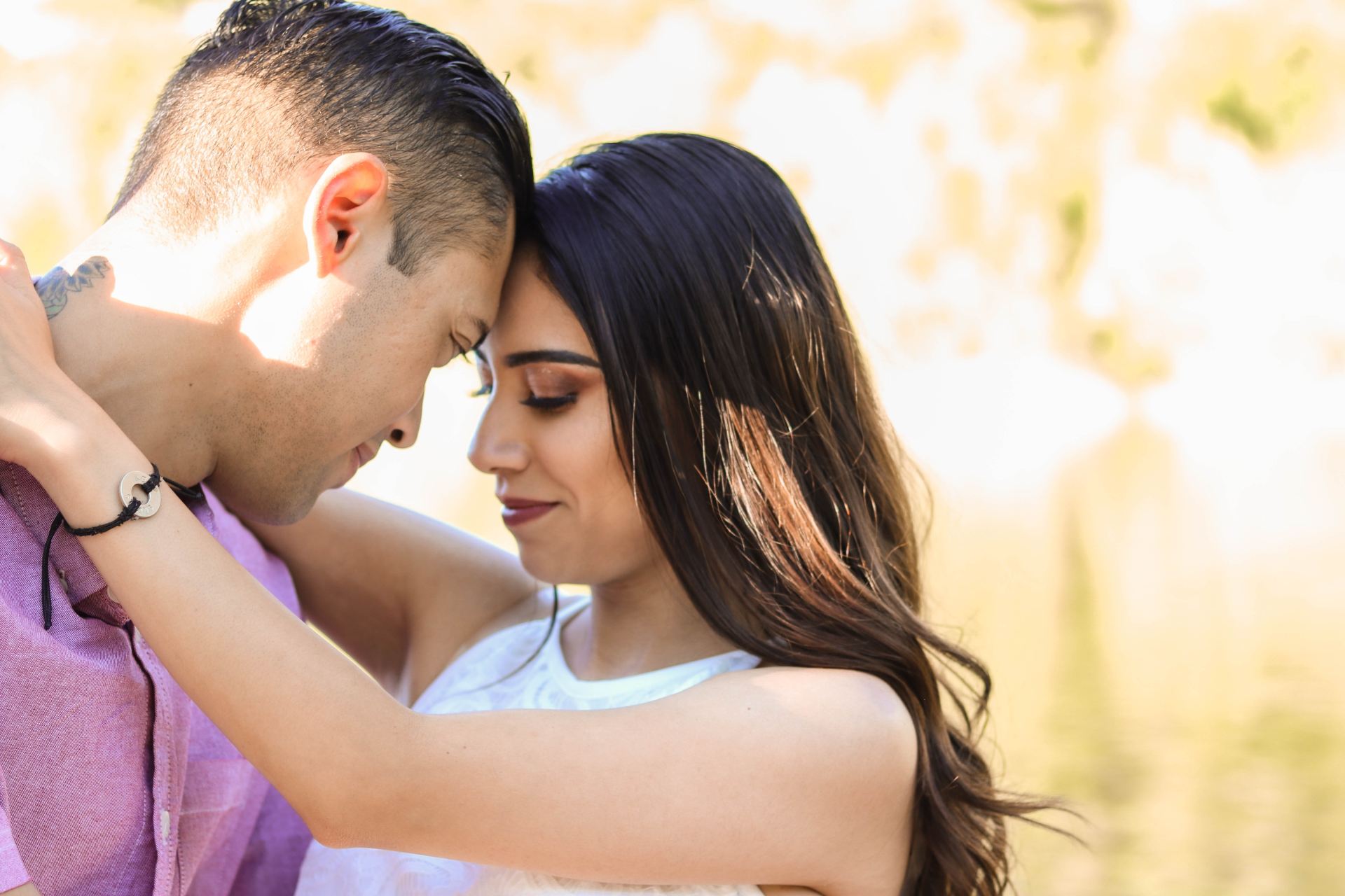 man and woman kissing during daytime