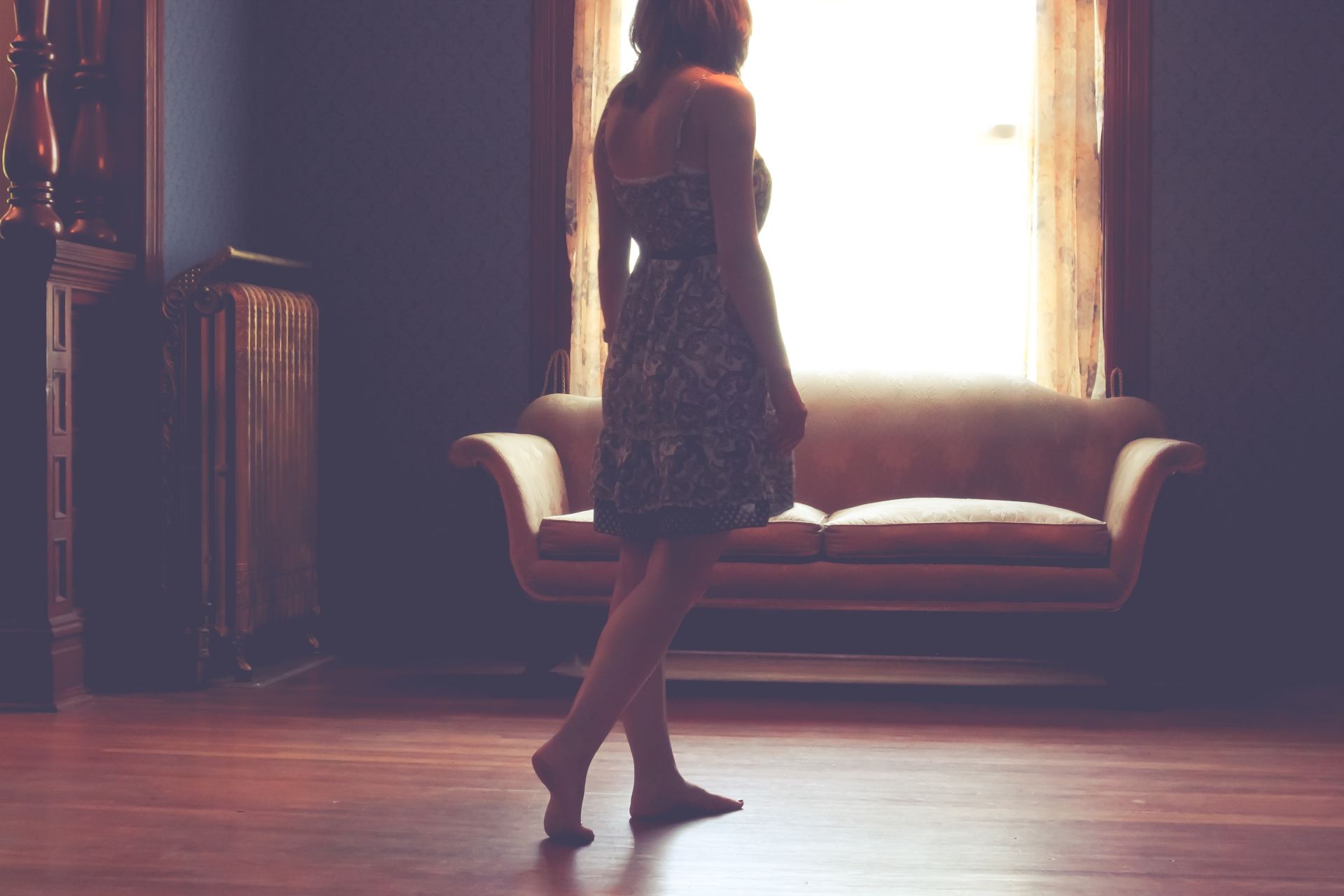 woman standing inside living room