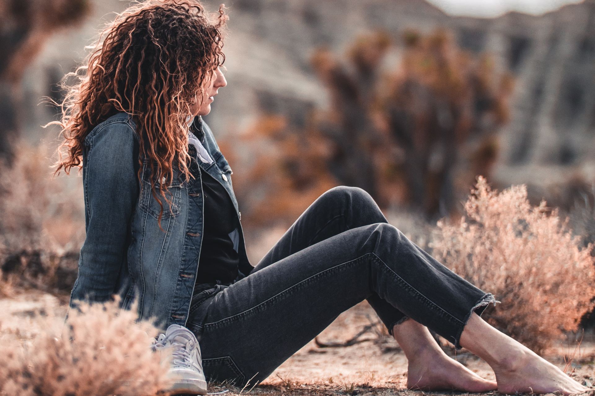 woman sitting on brown soil