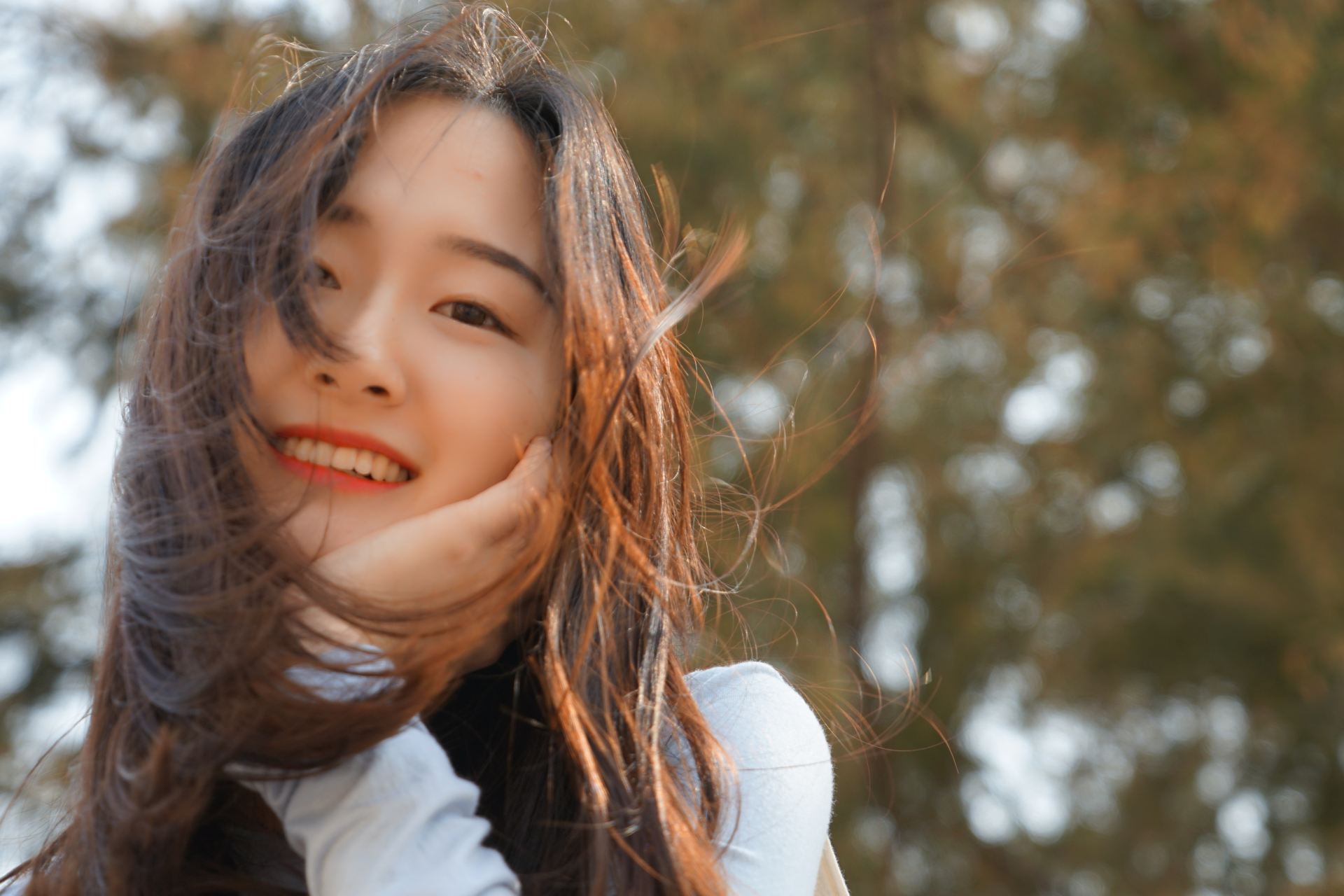 women holding her face during daytime