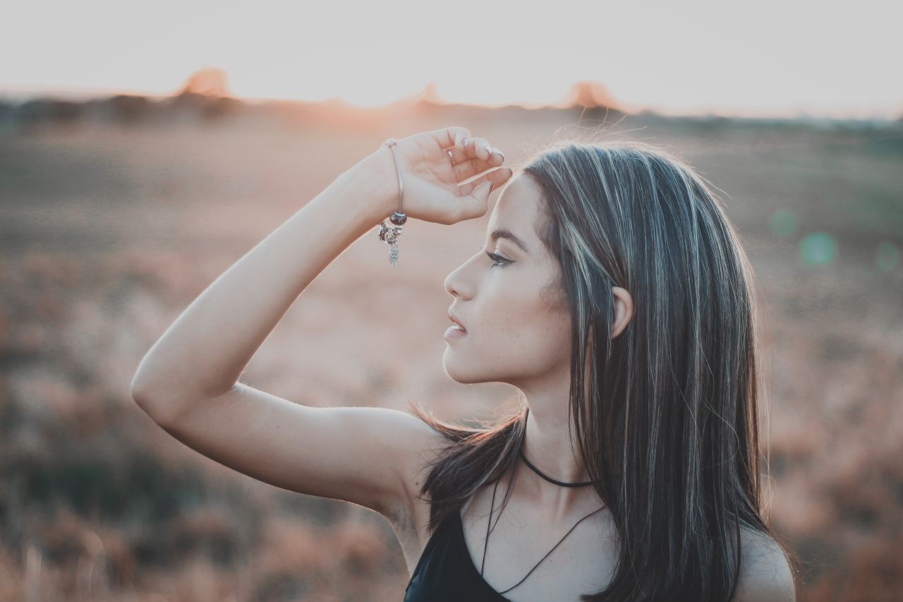 shallow focus photography of woman in black spaghetti strap top