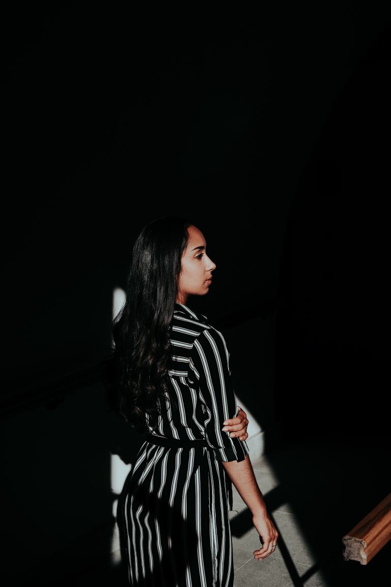 woman in black and white striped long sleeve shirt