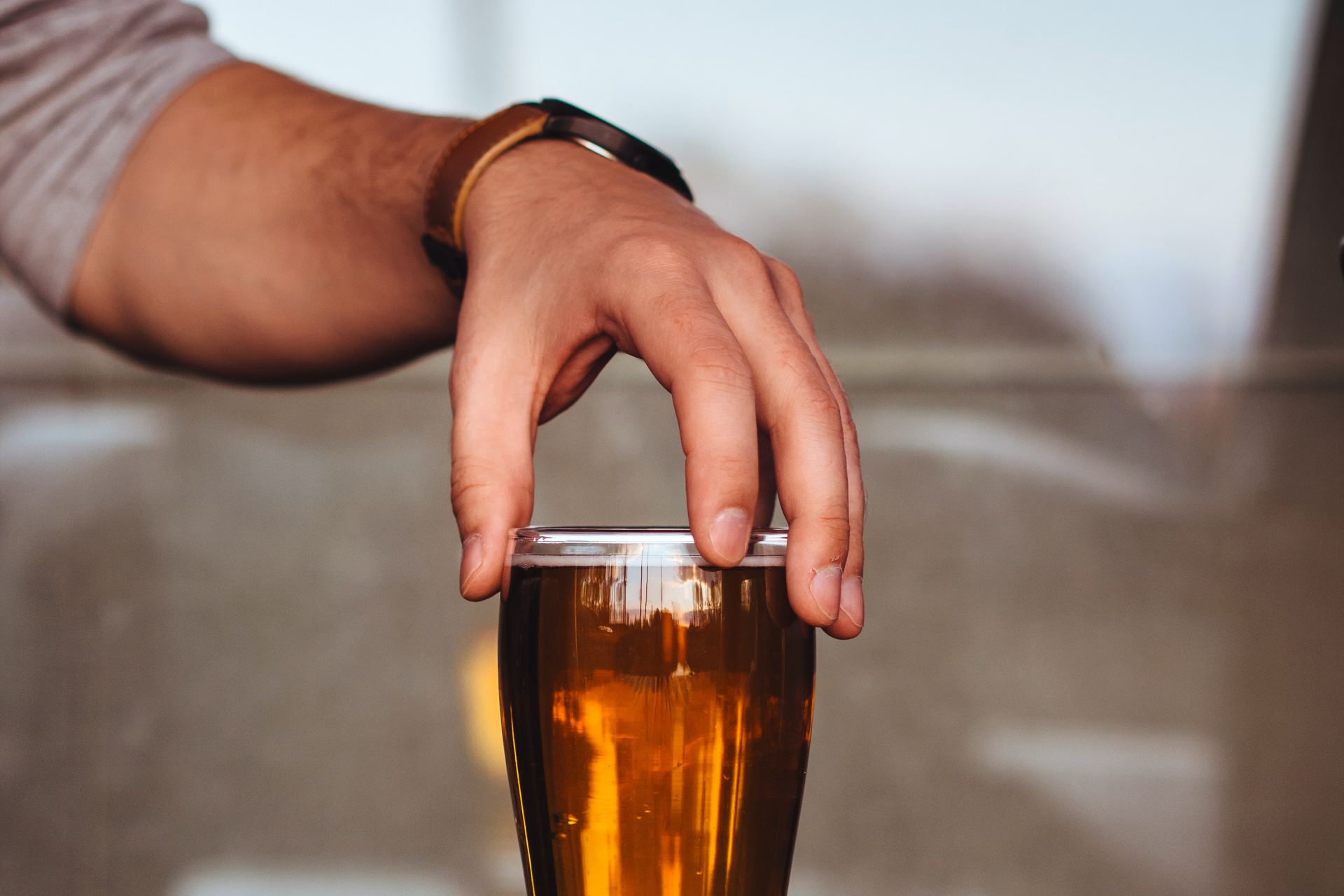 person holding glass cup