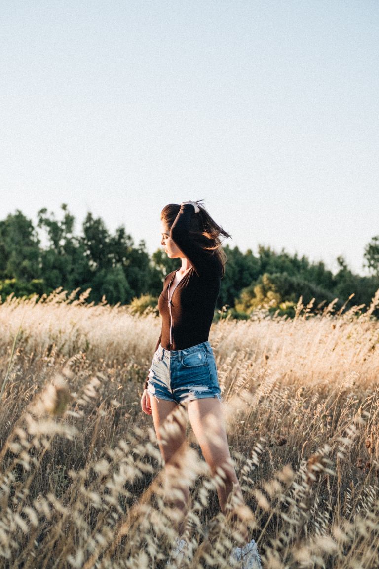 woman wearing blue short shorts