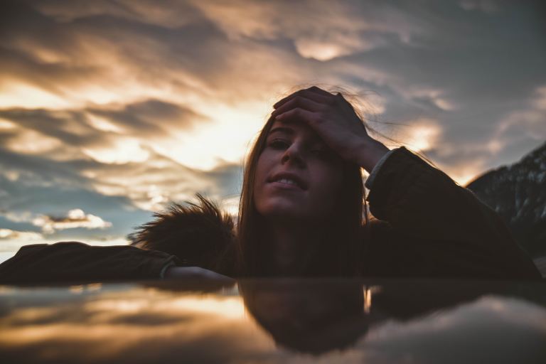 woman putting hand in head