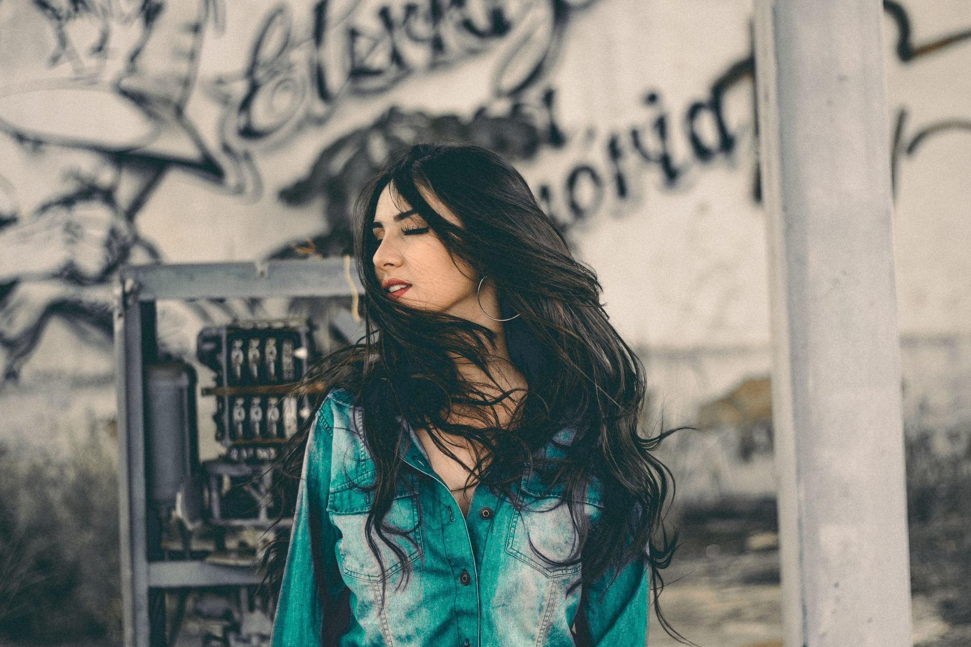 woman in teal and white top outdoor