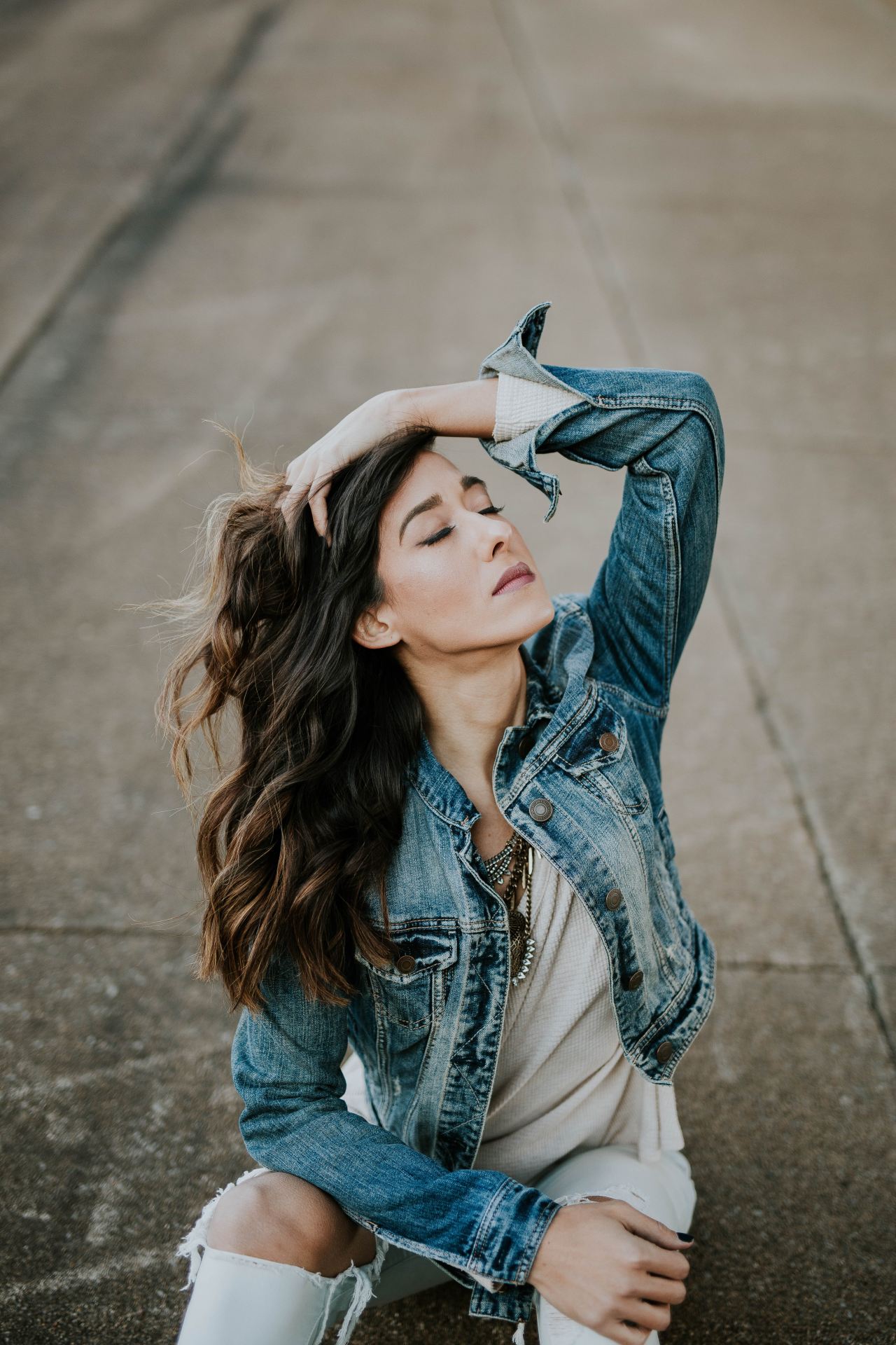 woman wearing blue denim jacket