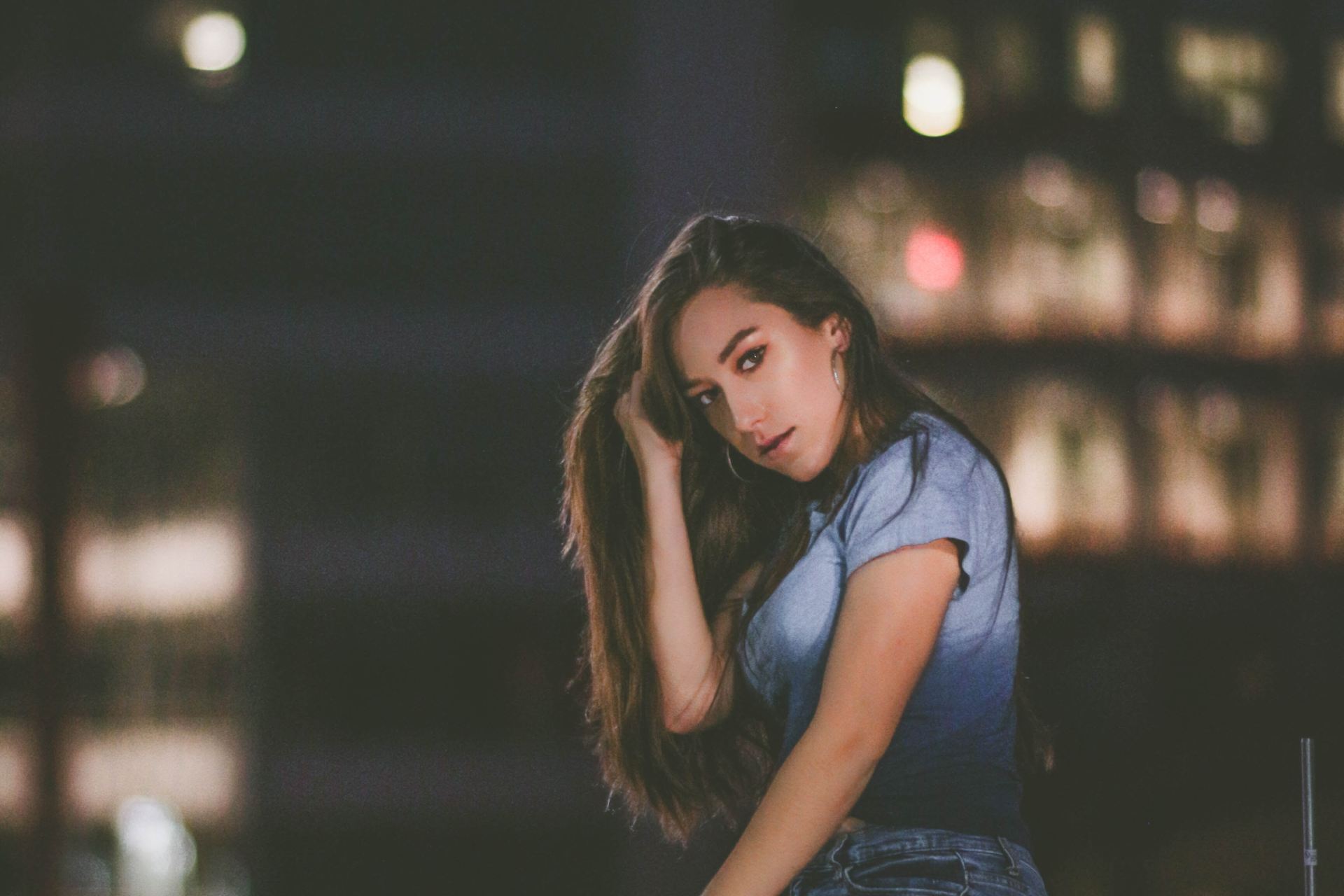 woman sitting on concrete block