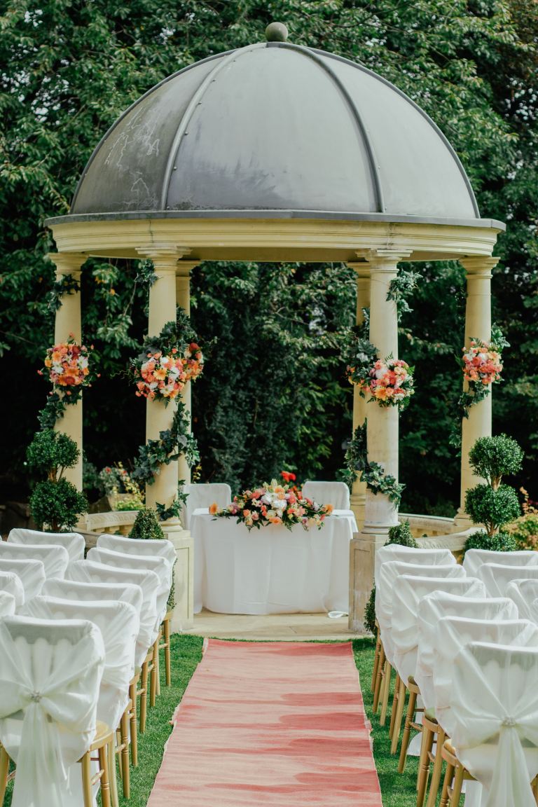 gray and beige gazebo near green leafed tree