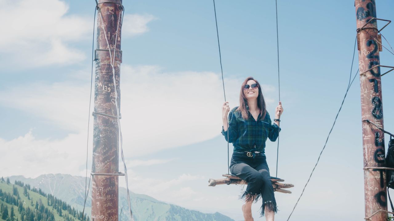 woman riding on swing