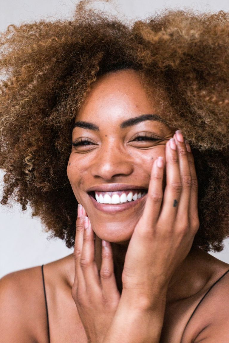 smiling woman with brown hair