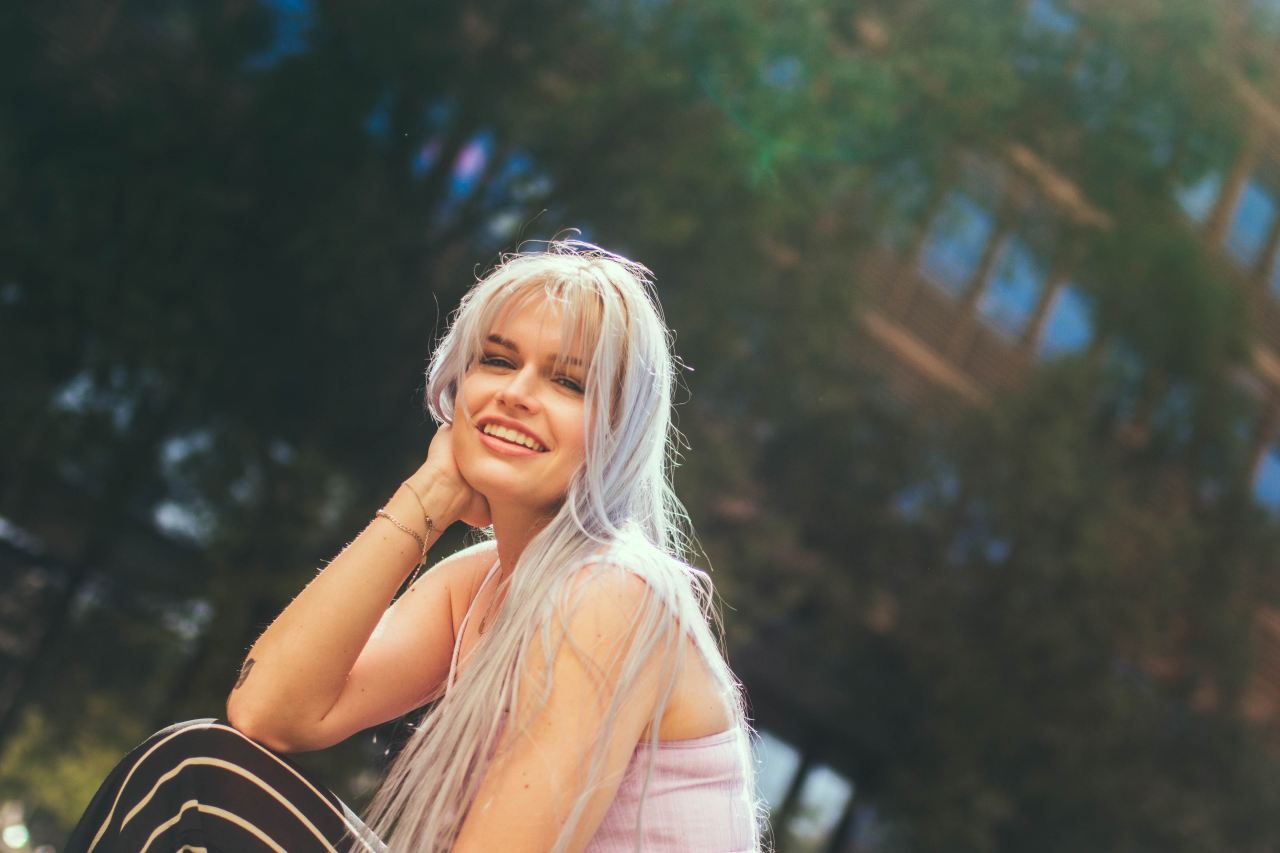 woman in pink top smiling