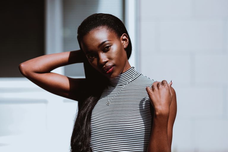 woman in black and white striped shirt