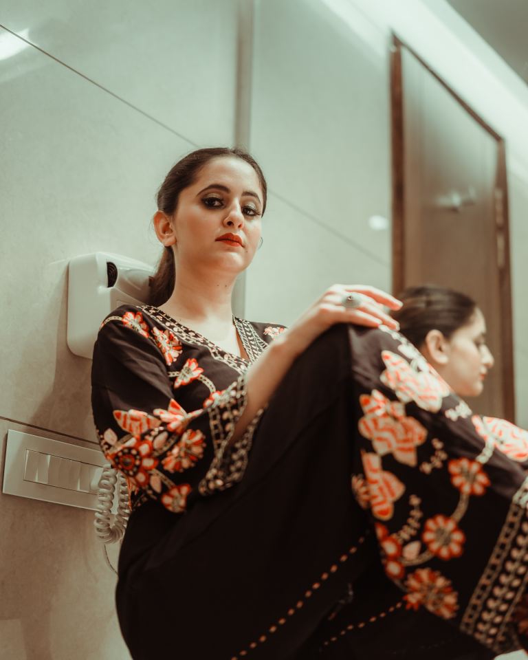 woman in black and brown floral dress